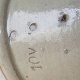 Pot with pheasant in earth