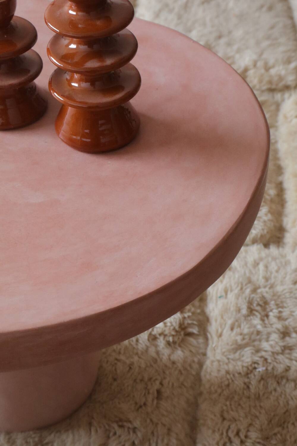 Organic shaped coffee table in pink teracotta tadelakt