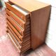 Brown teak Mid-Century chest of drawers with 7 drawers from the 1960s, sleek lines, discreet base.