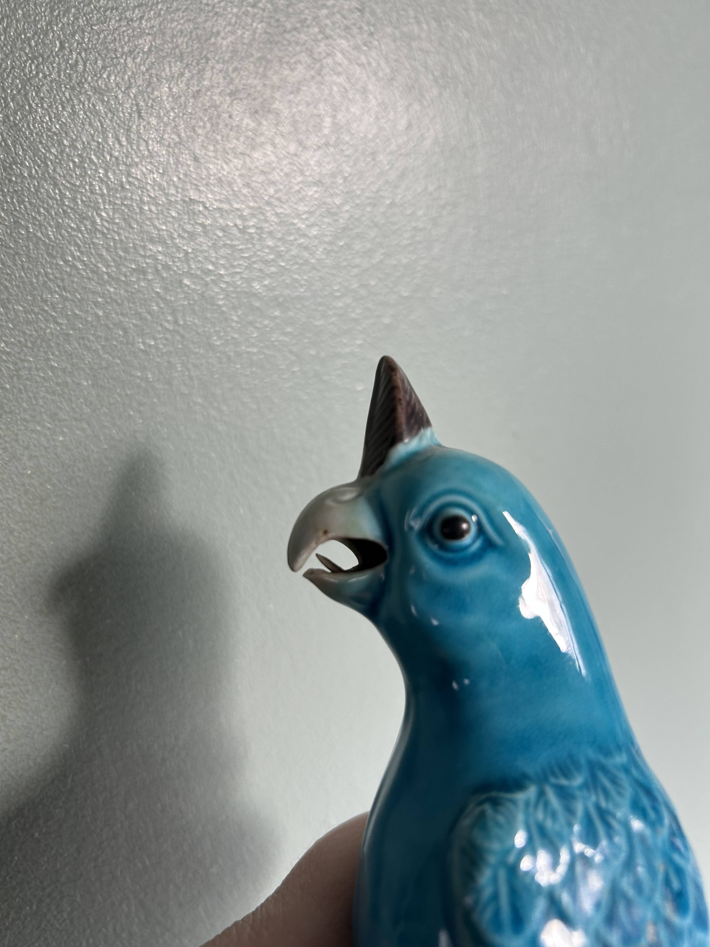Porcelain parrot statuette