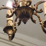 Chandelier in gilded with six arms chiseled bronze.