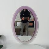 Vintage oval plexiglass mirror from the 70s by Harvey Guzzini