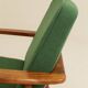 Scandinavian modern chair in green wool, vintage wooden armchair.