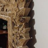 Mirror with its openwork frame