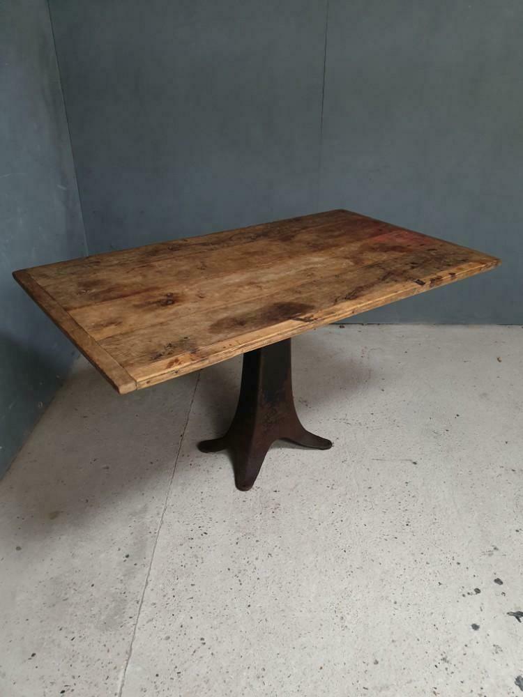 Old table on cast iron machine leg