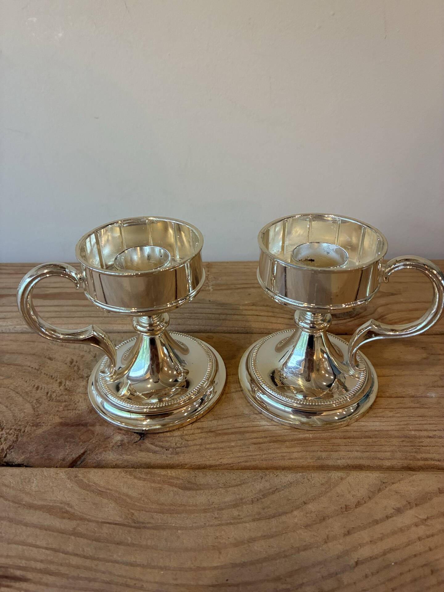 Pair of vintage silver-plated candlesticks with handles