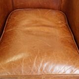 Very comfortable, elegant leather club armchair with a removable seat cushion and timeless design