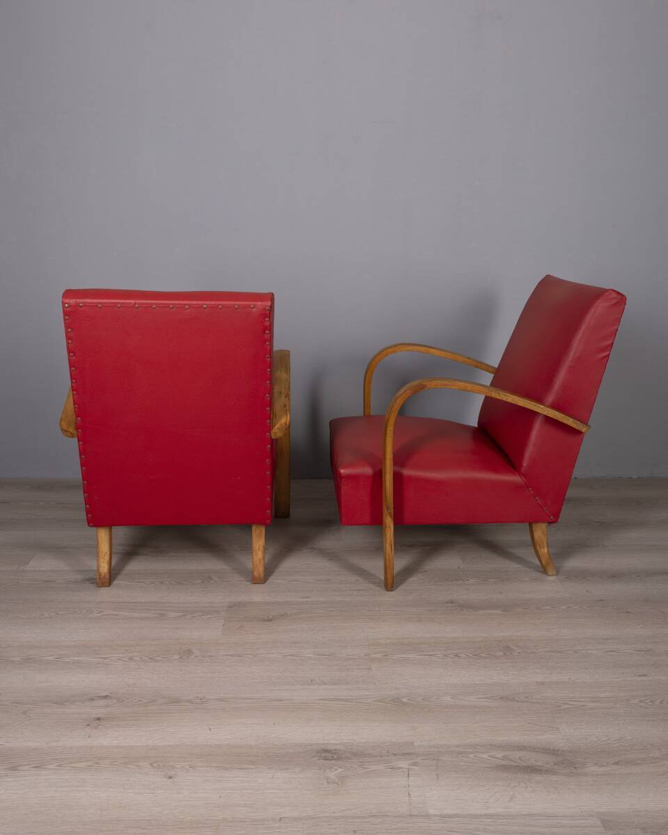 Pair of vintage 1950's armchairs in red leather, italian design