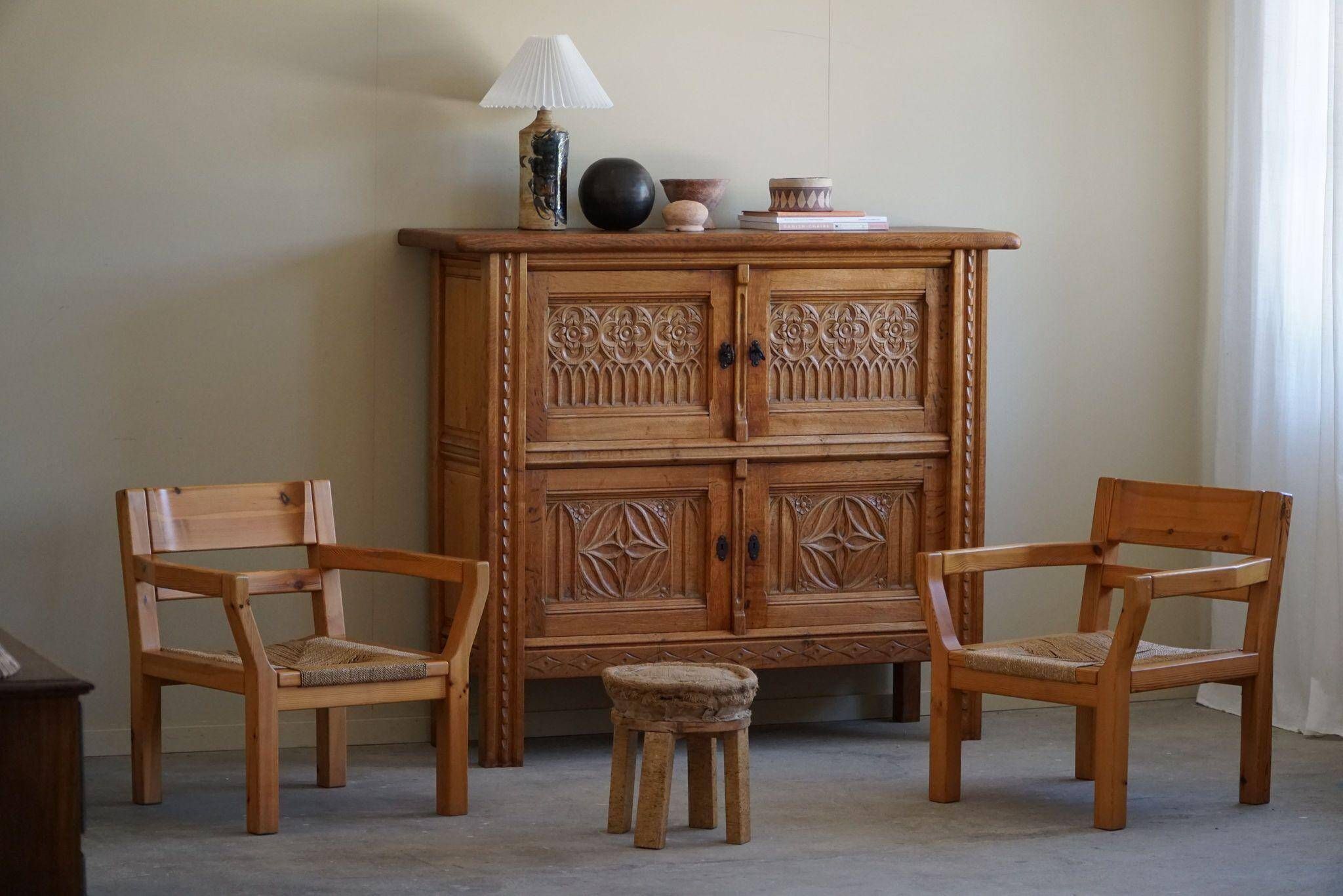 Tage Poulsen, a pair of brutalist chairs in pine and cord, Danish modern style, 1970s.