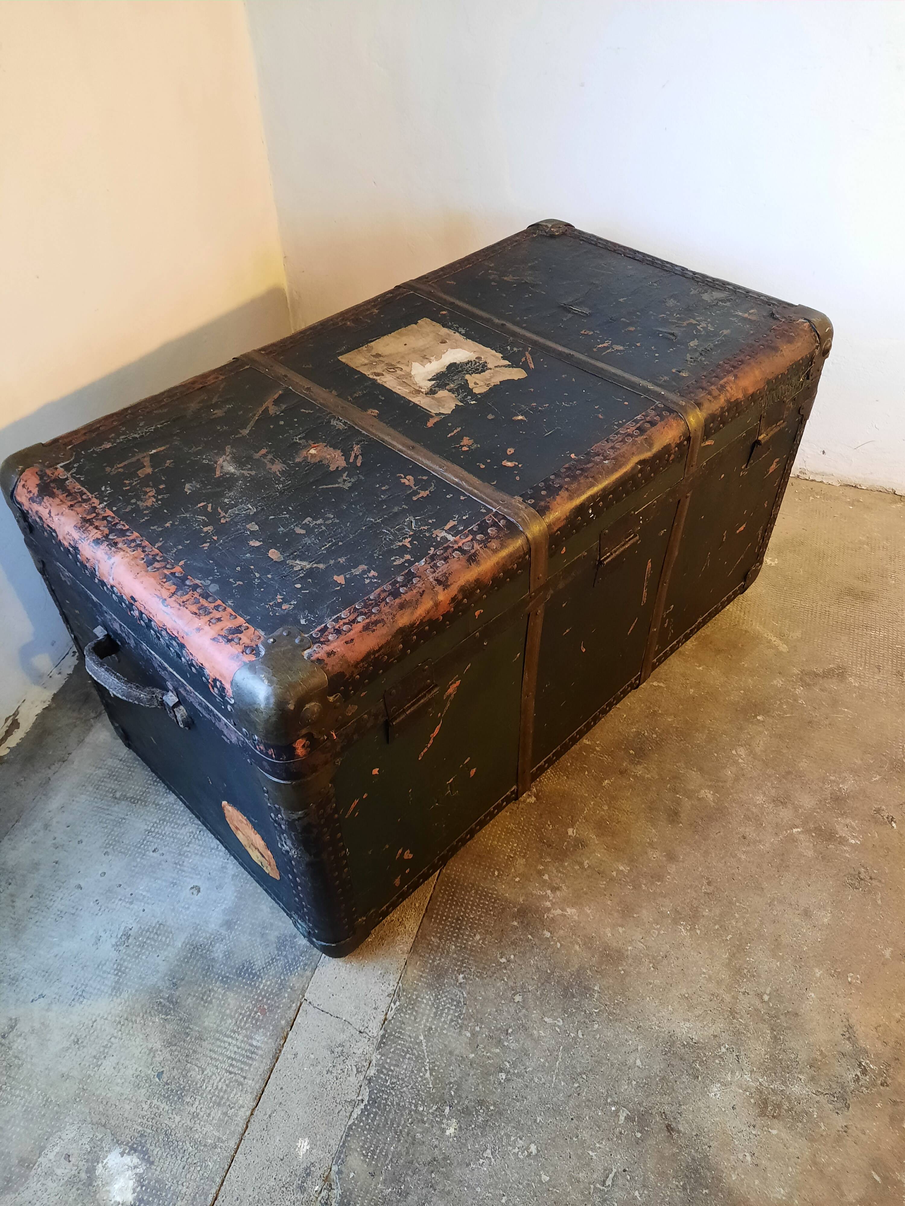 Old and large travel trunk, brass-plated corners