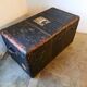 Old and large travel trunk, brass-plated corners
