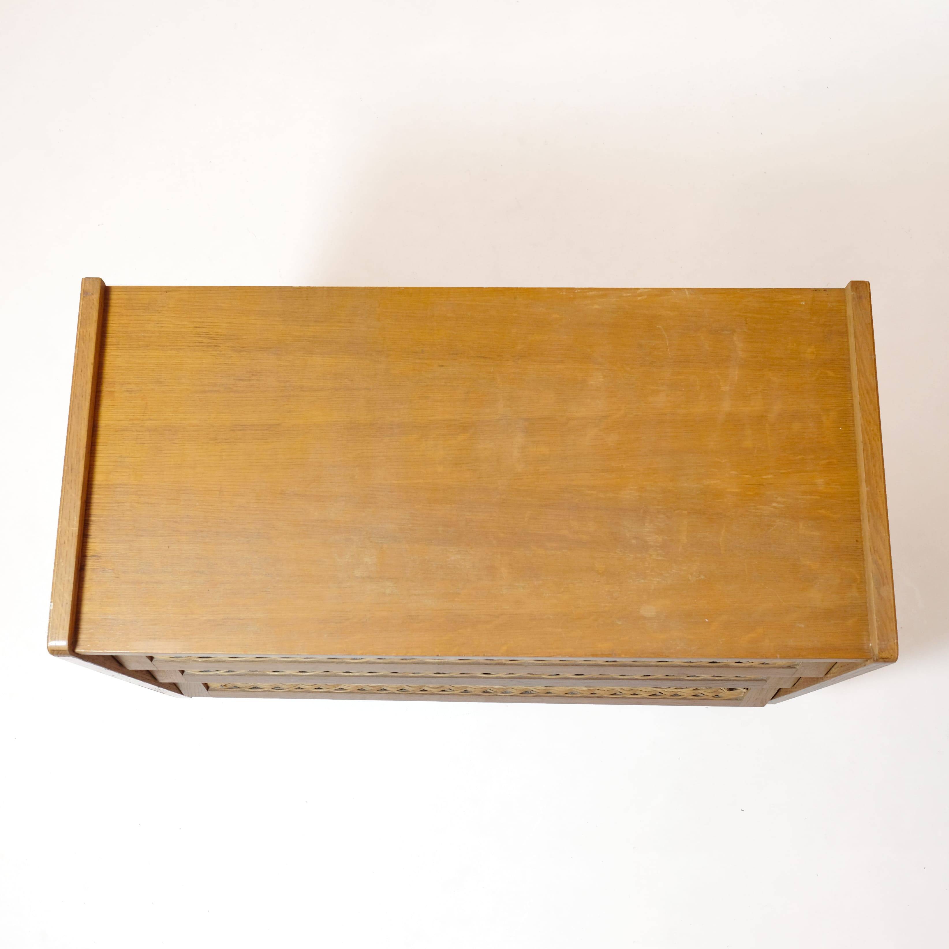 Wooden and rattan chest of drawers from the 60s.