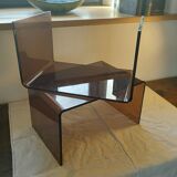 Matching pair of sofa foot stools in smoked perspex 1970