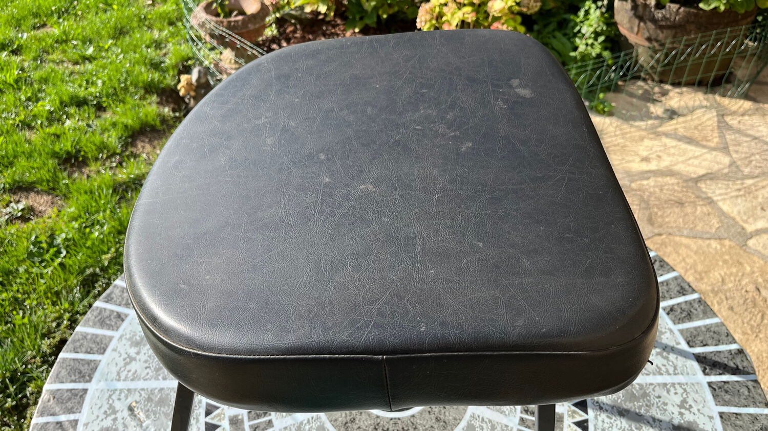Low black leatherette stool from the 60s/70s