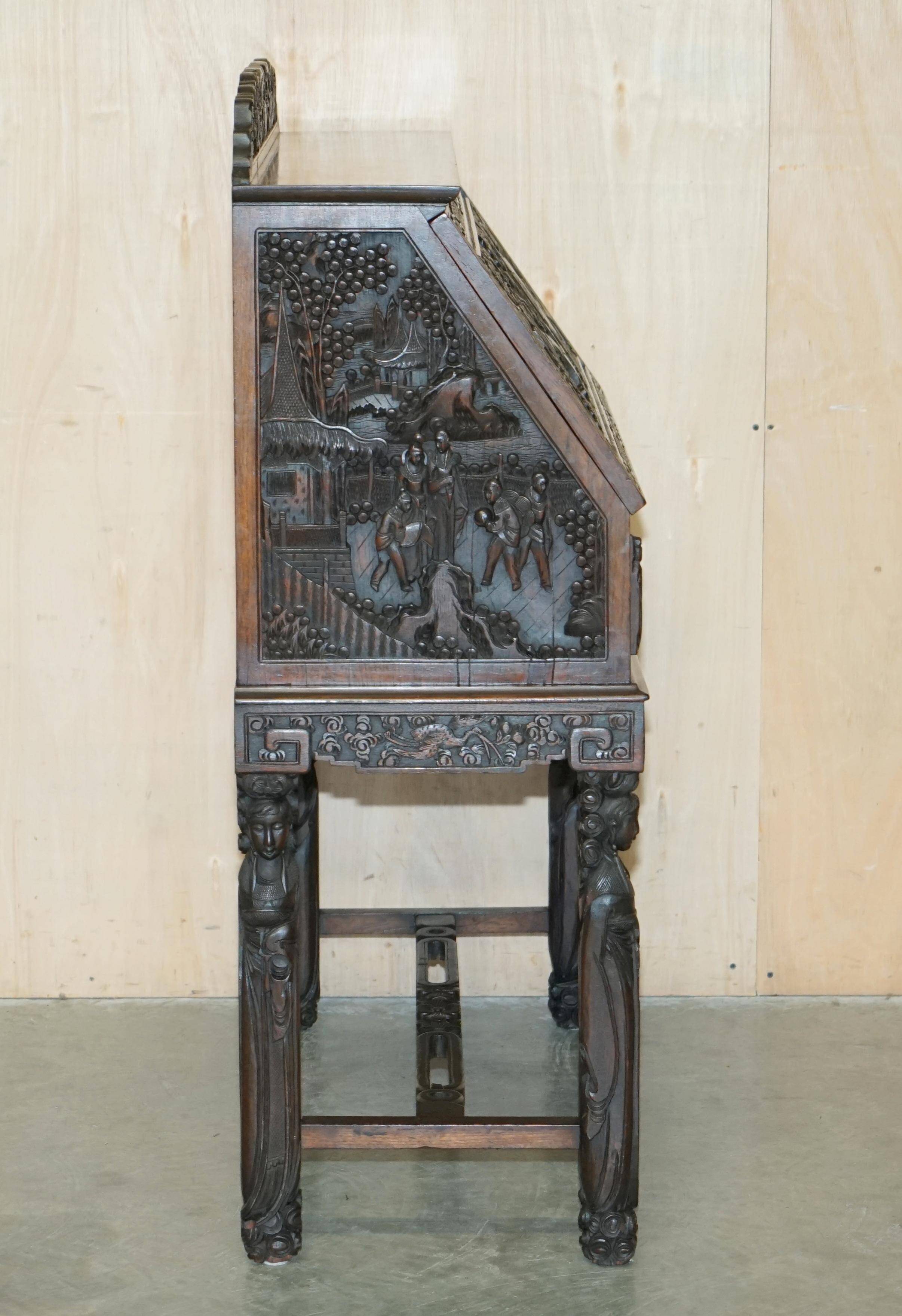 Chinese hand-carved desk from around 1940 with matching chair.