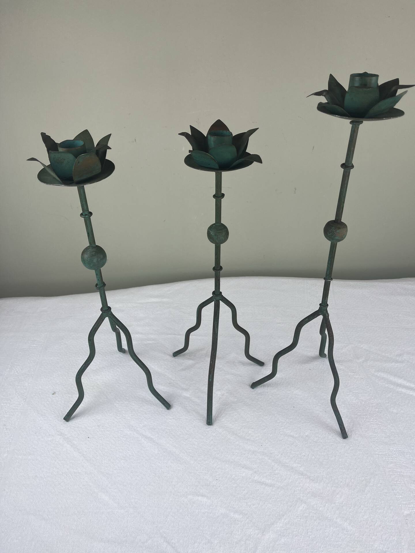 Sculptural candle holder trio