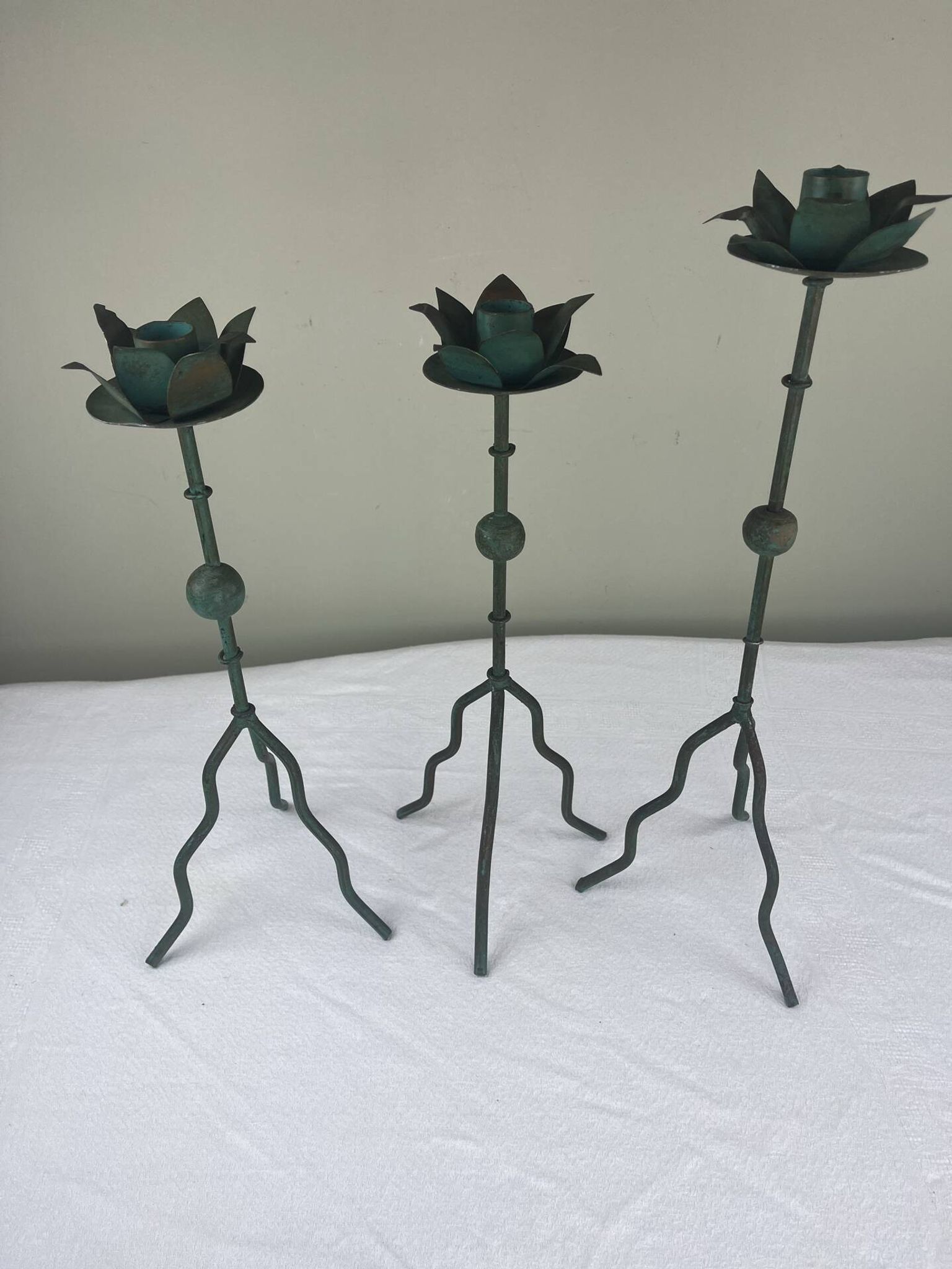 Sculptural candle holder trio