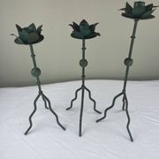Sculptural candle holder trio