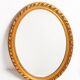 Decorative oval mirror with a floral frame, Italy, 1960s.