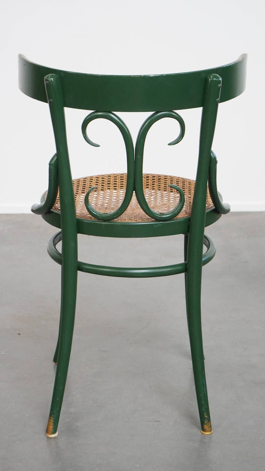 Vintage green bistro chair with woven reed seat