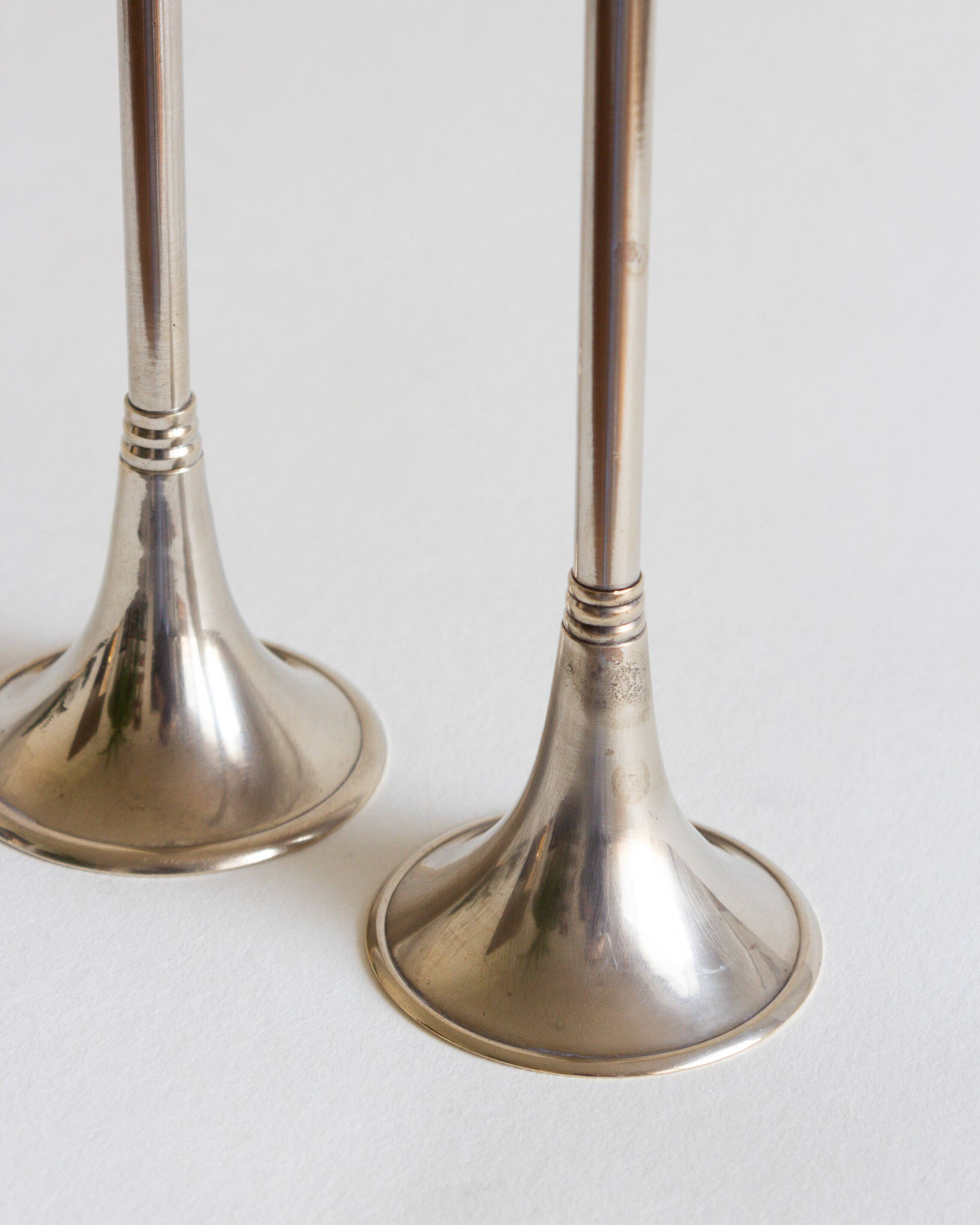 Duo of silver-plated brass candlesticks, 1950s/1960s