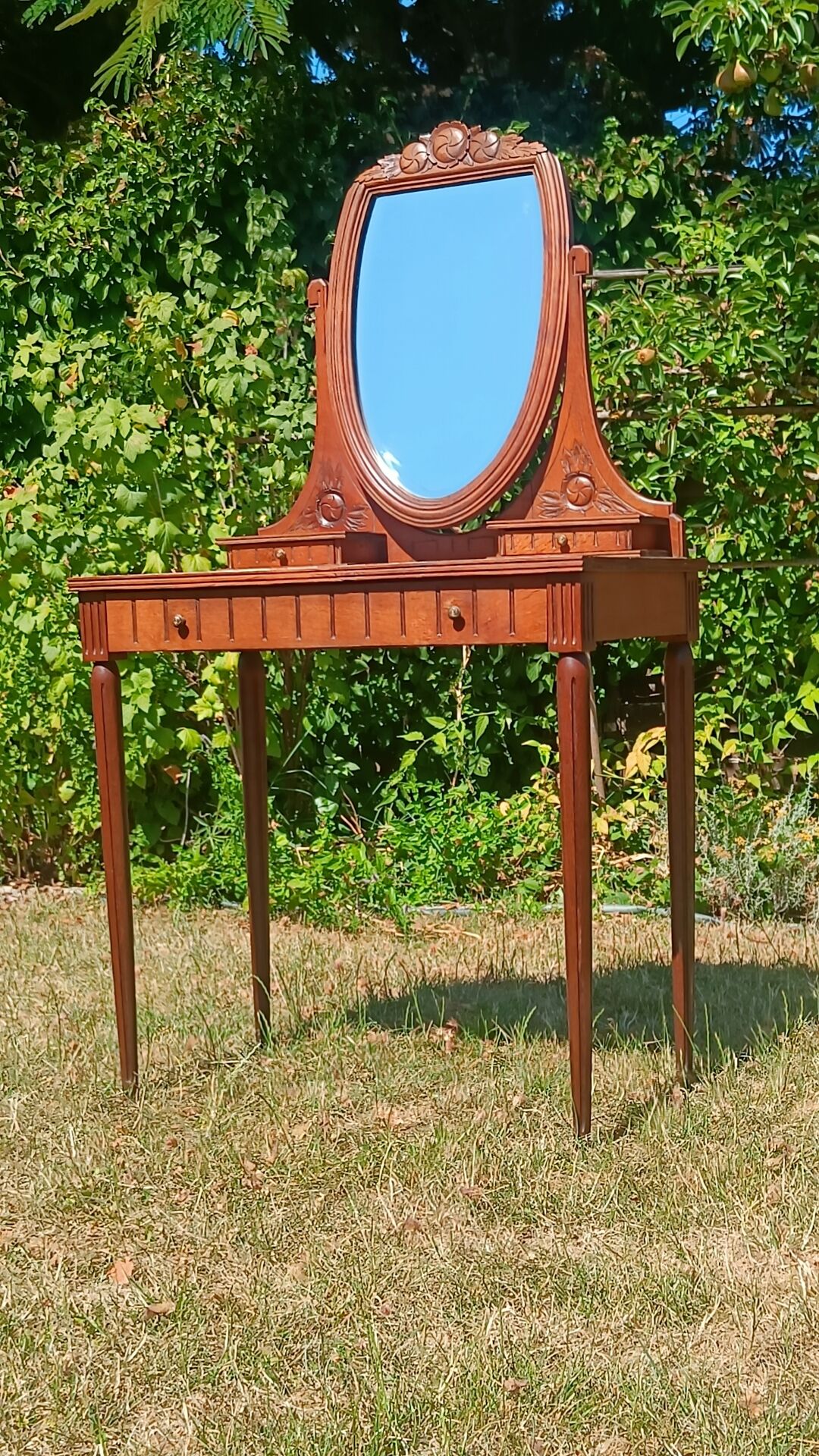 Art Deco oak dressing table, marble top and swivel mirror.