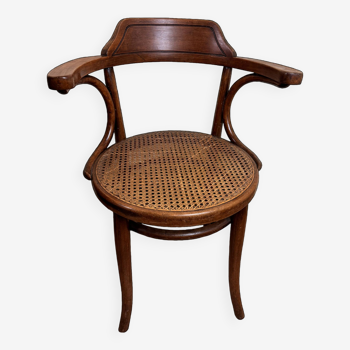 Thonet Vienne: office armchair with bentwood structure and cane seat.