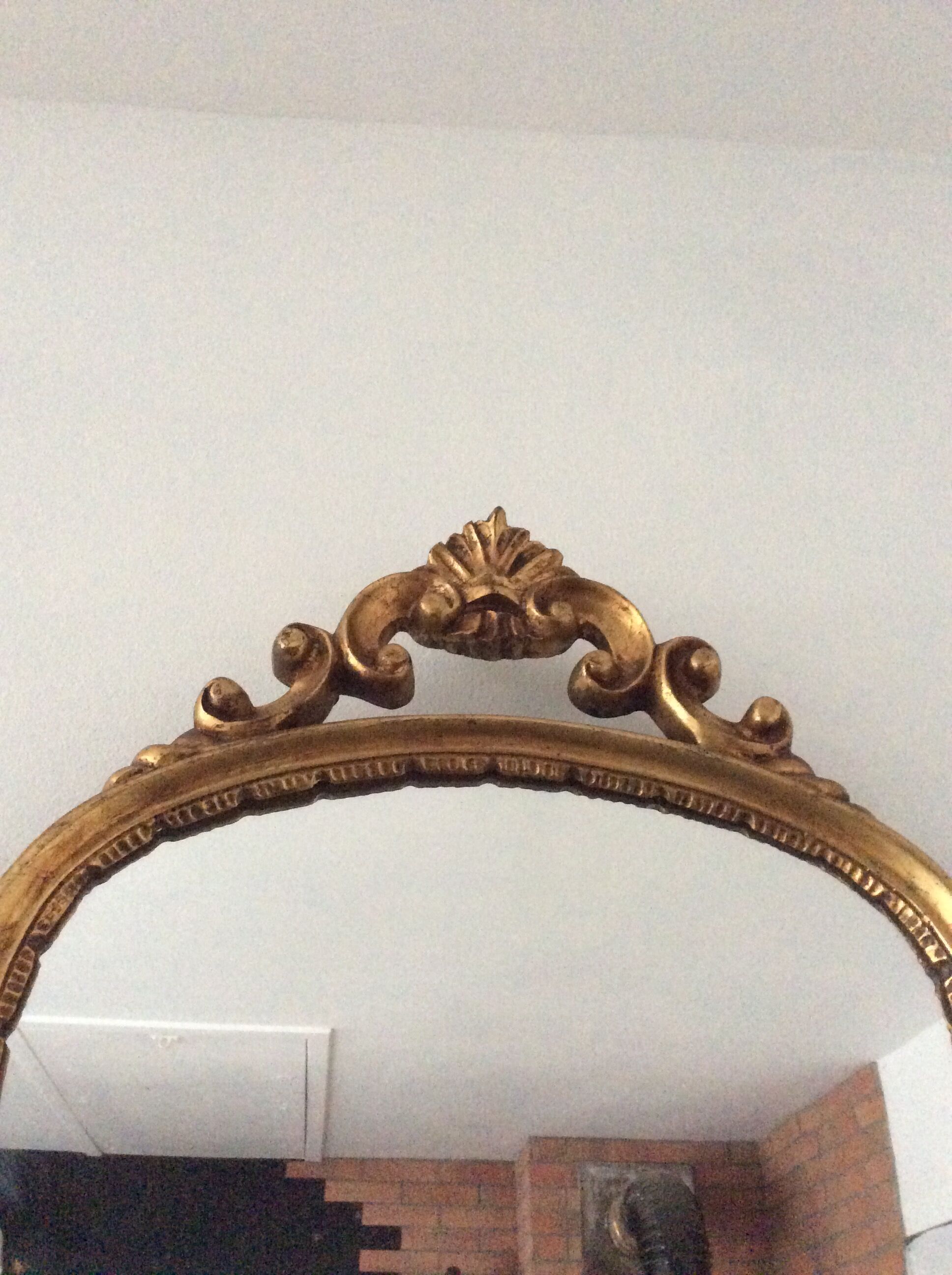 Old vintage mirror in gilded wood
