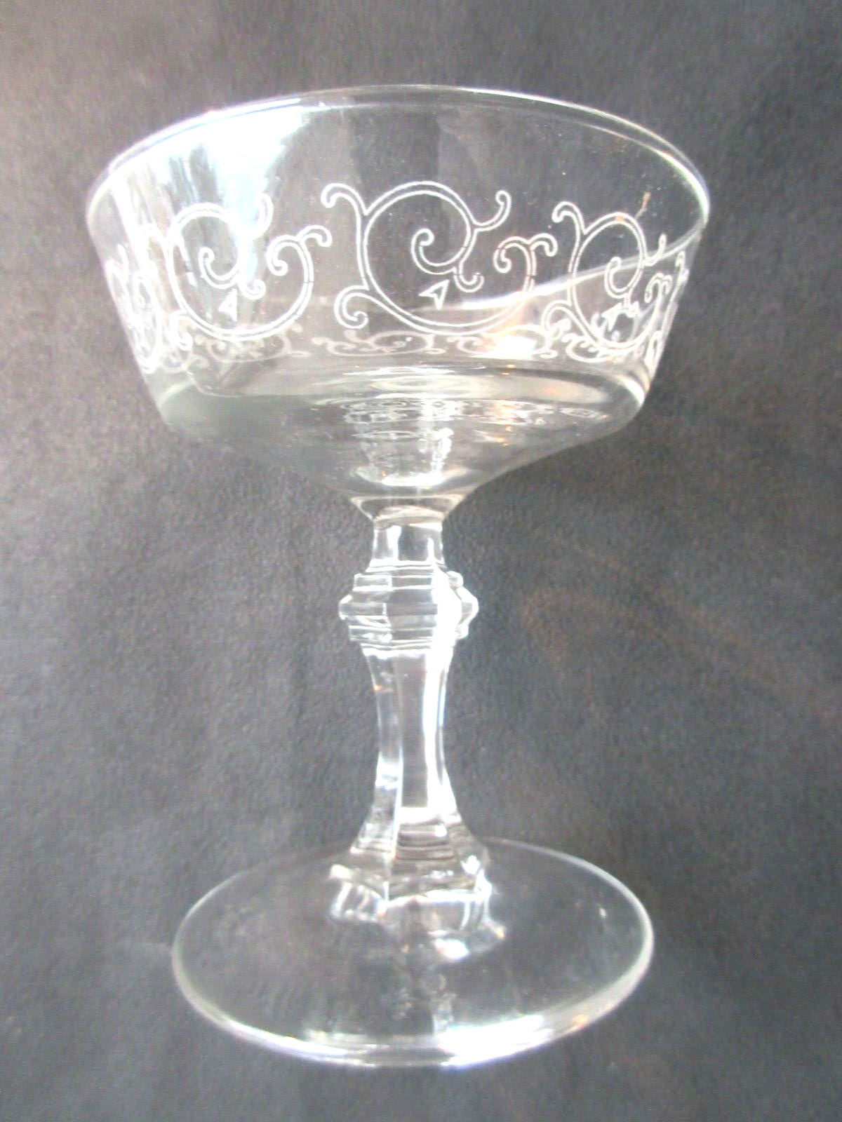 6 Louis XV style champagne glasses engraved with arabesques, baluster foot