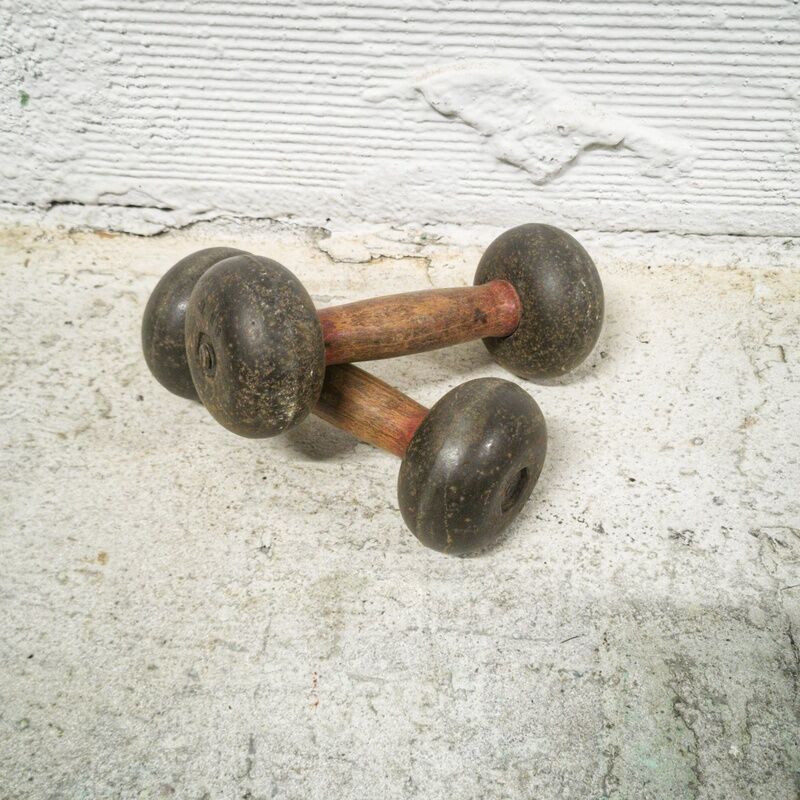 Pair of vintage dumbbells in cast iron and wood