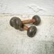 Pair of vintage dumbbells in cast iron and wood