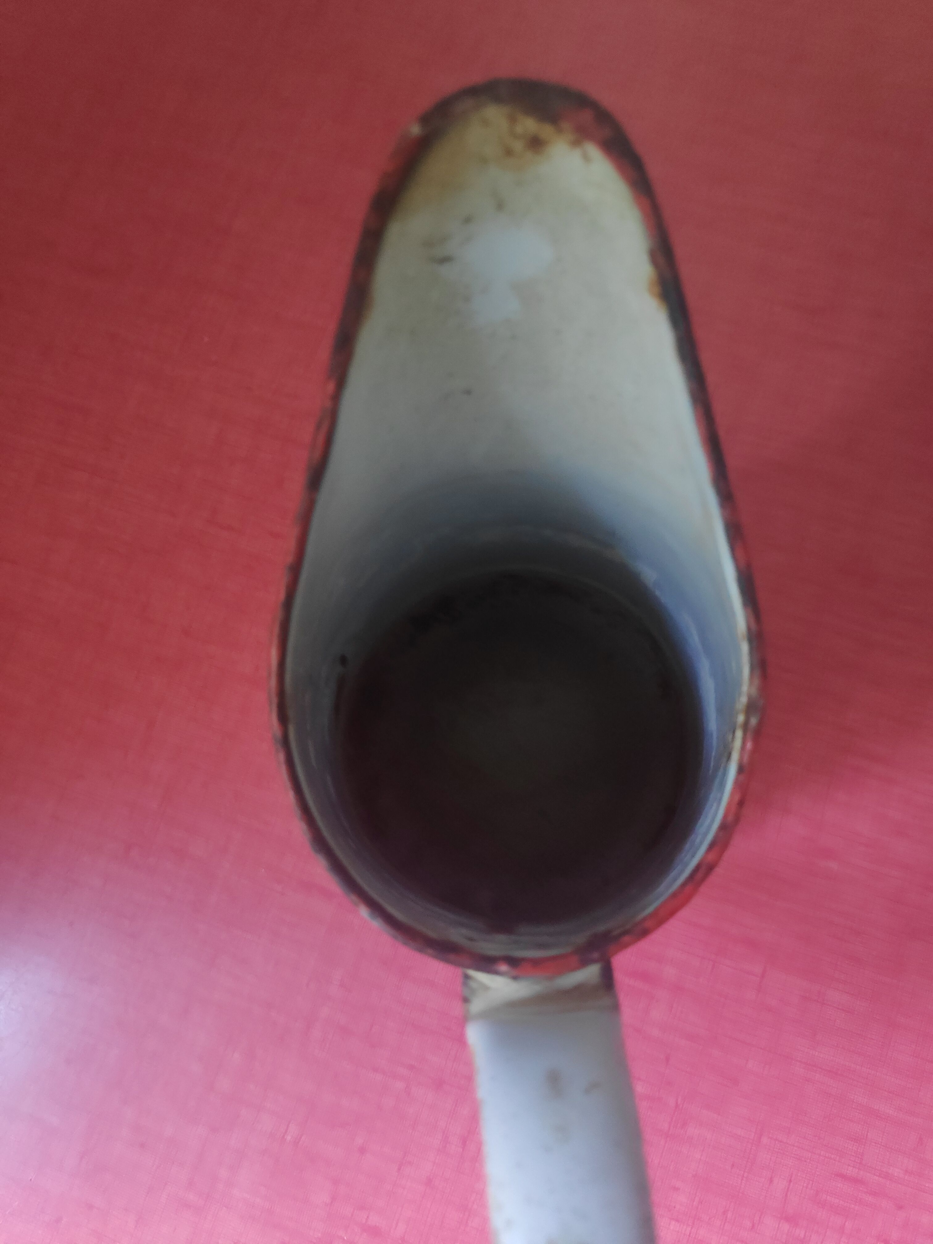 Enamelled sheet metal pitcher Lustucru décor