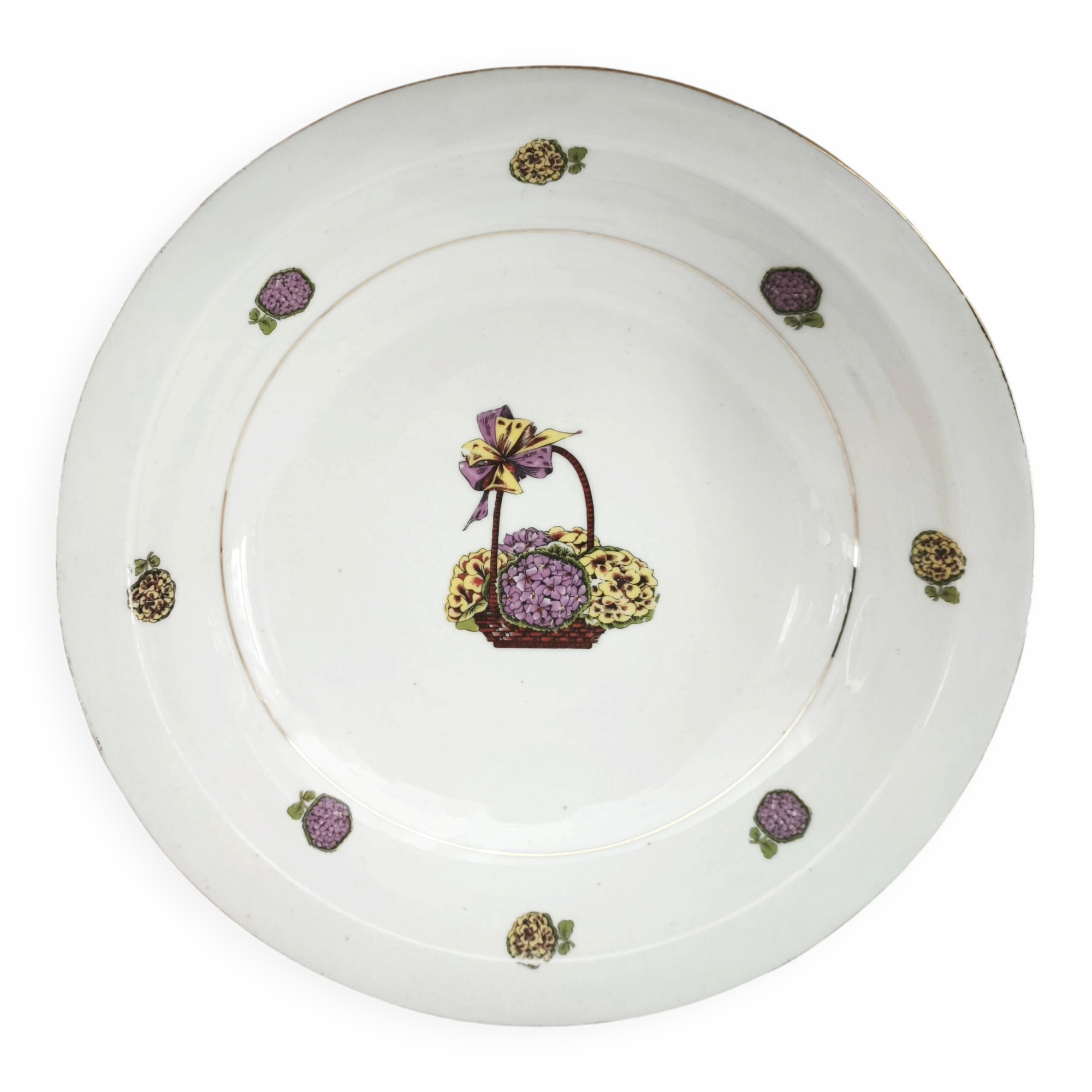 Shallow round plate in Limoges porcelain with a hydrangea basket design.