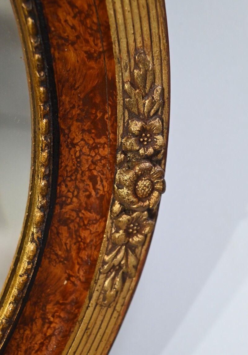 Oval mirror in gilded wood – early twentieth century