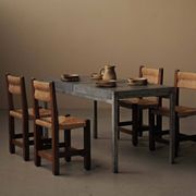 Set of four modernist chairs in oak and straw, France, circa 1960.