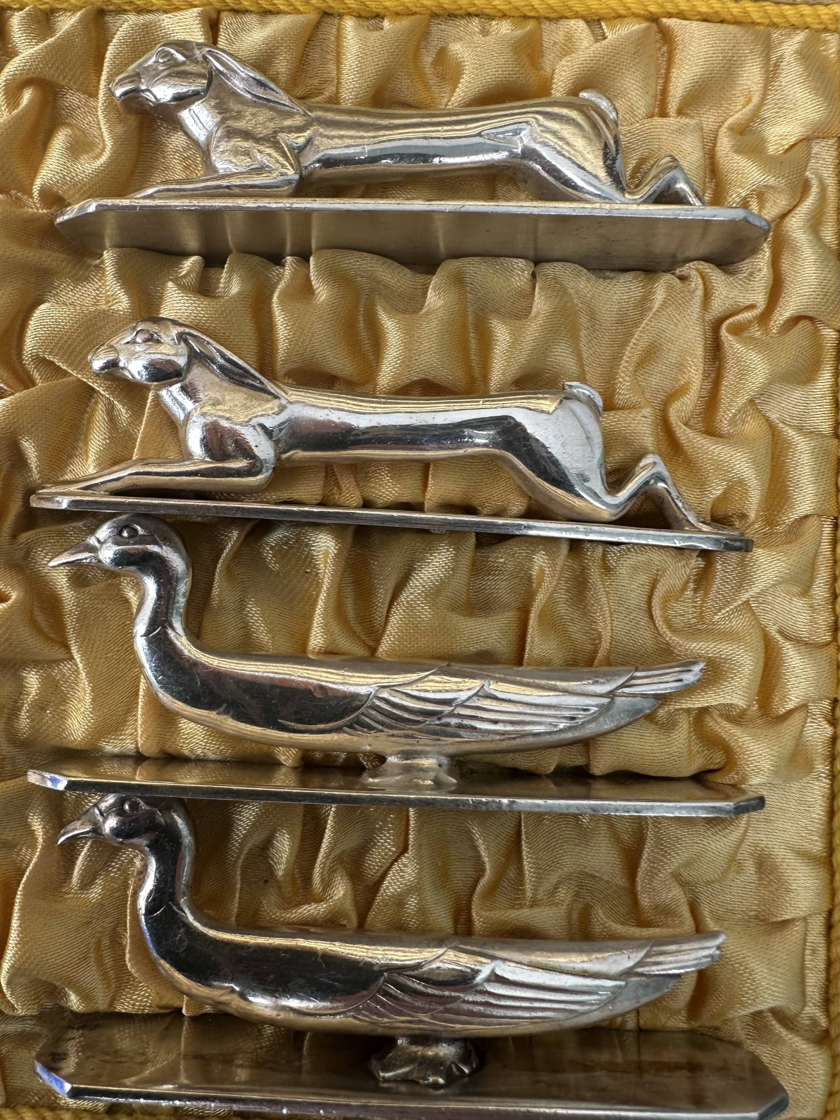 12 antique silver-plated bronze knife rests in modern art deco animal designs.