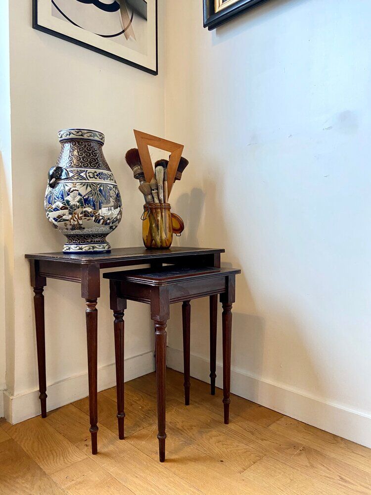 Dark wood and black leather tables