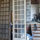 Two pairs of solid oak doors with small panes.