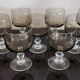 9 white wine glasses on vintage Luminarc smoked black stem