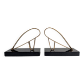 golden metal vintage bookends with black marble base – graphic design