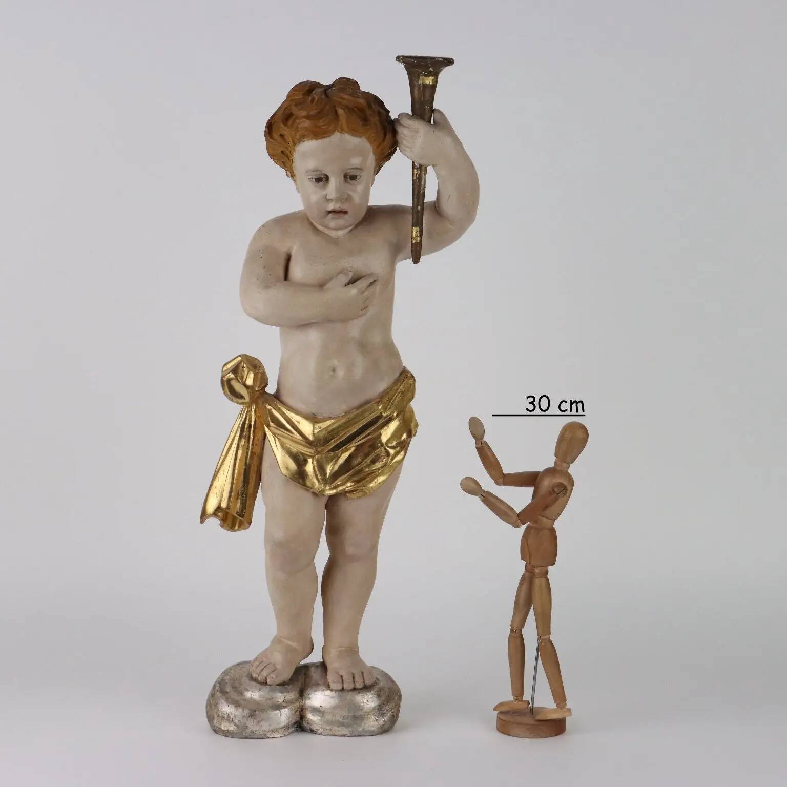 Ancient sculpture of a putto in carved and gilded wood, Italy, 19th century.