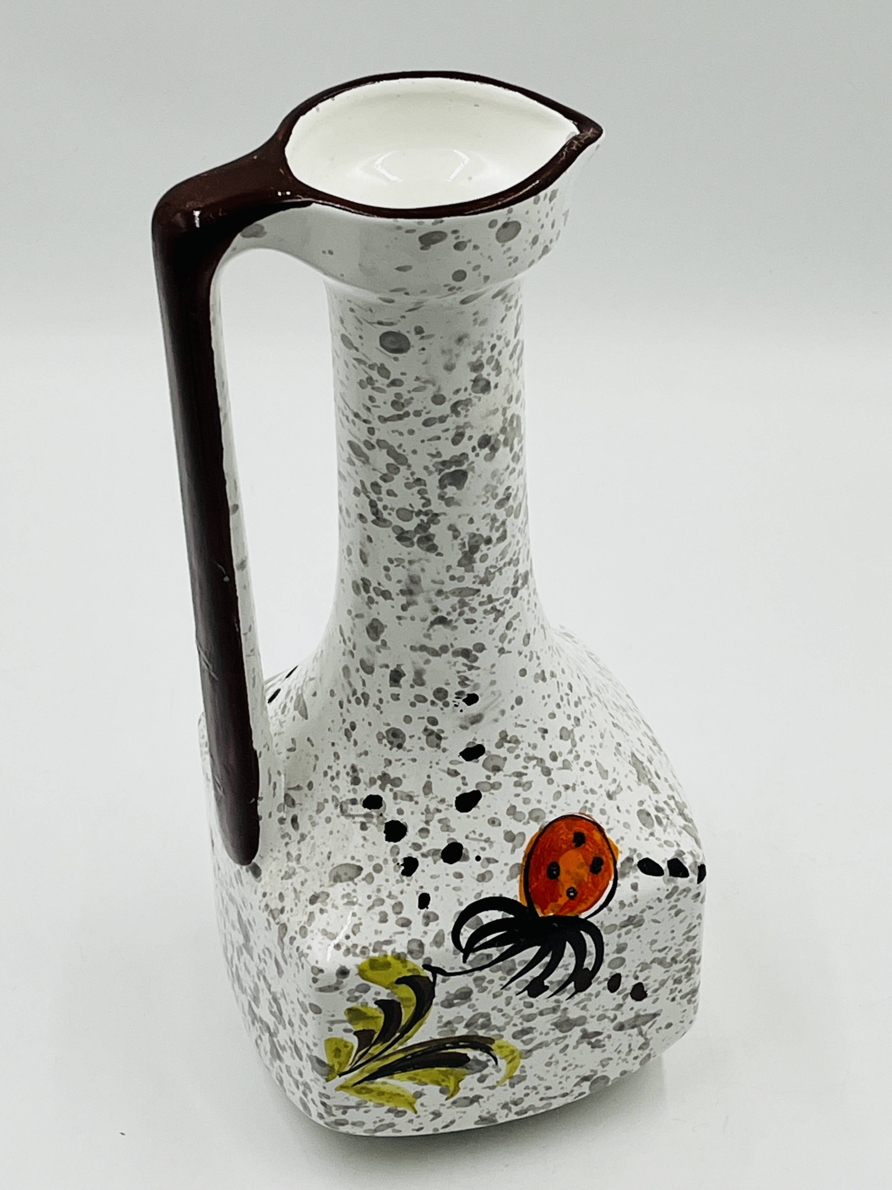 Vintage Italian vase in the shape of a carafe with floral decoration from the 1970s.