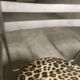 Pair of folding chairs from the 80s with leopard print seats.