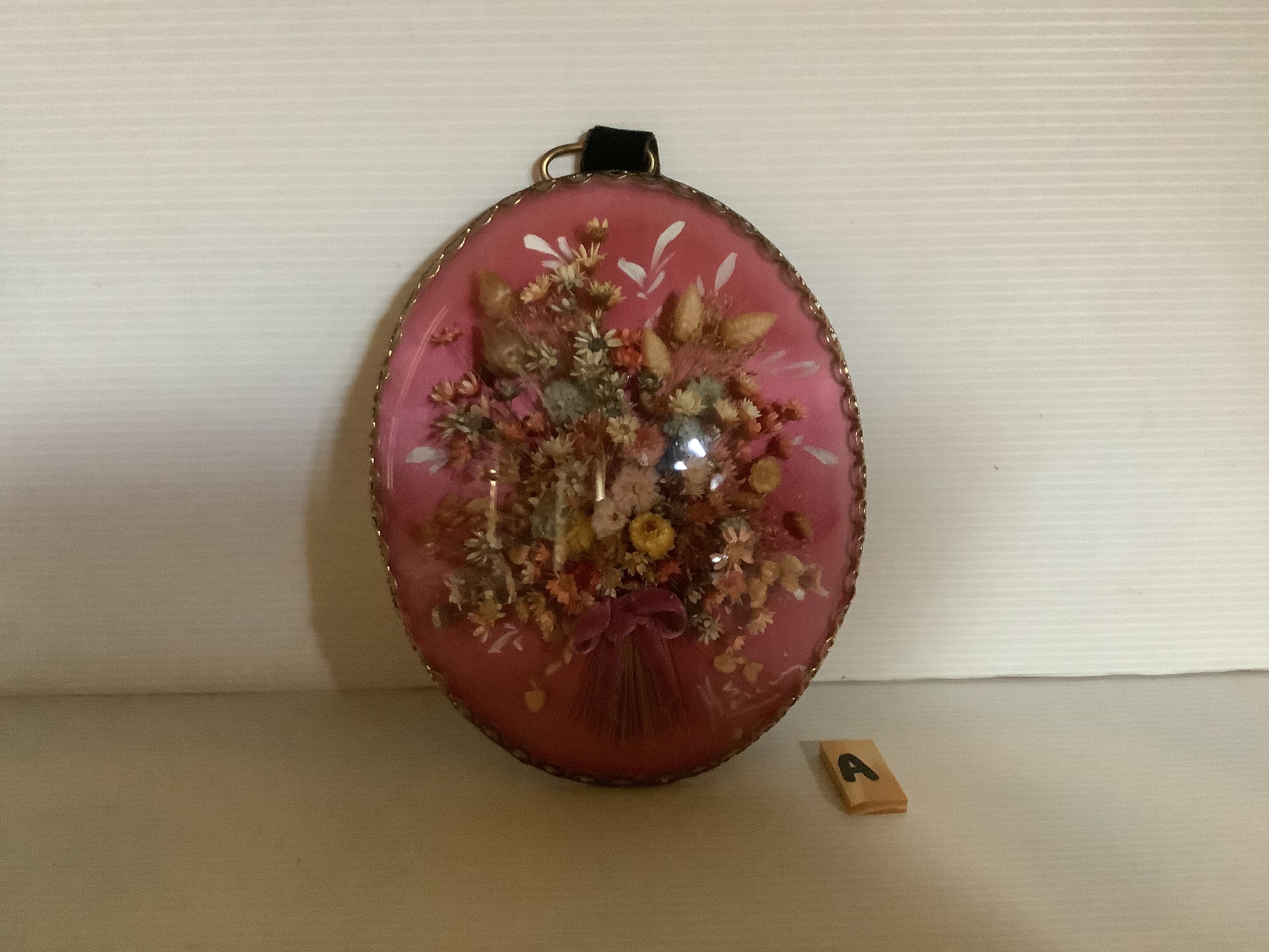 Old vintage oval dried flowers frame