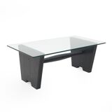 Coffee table with a glass top and black stained wood frame, 1930s.