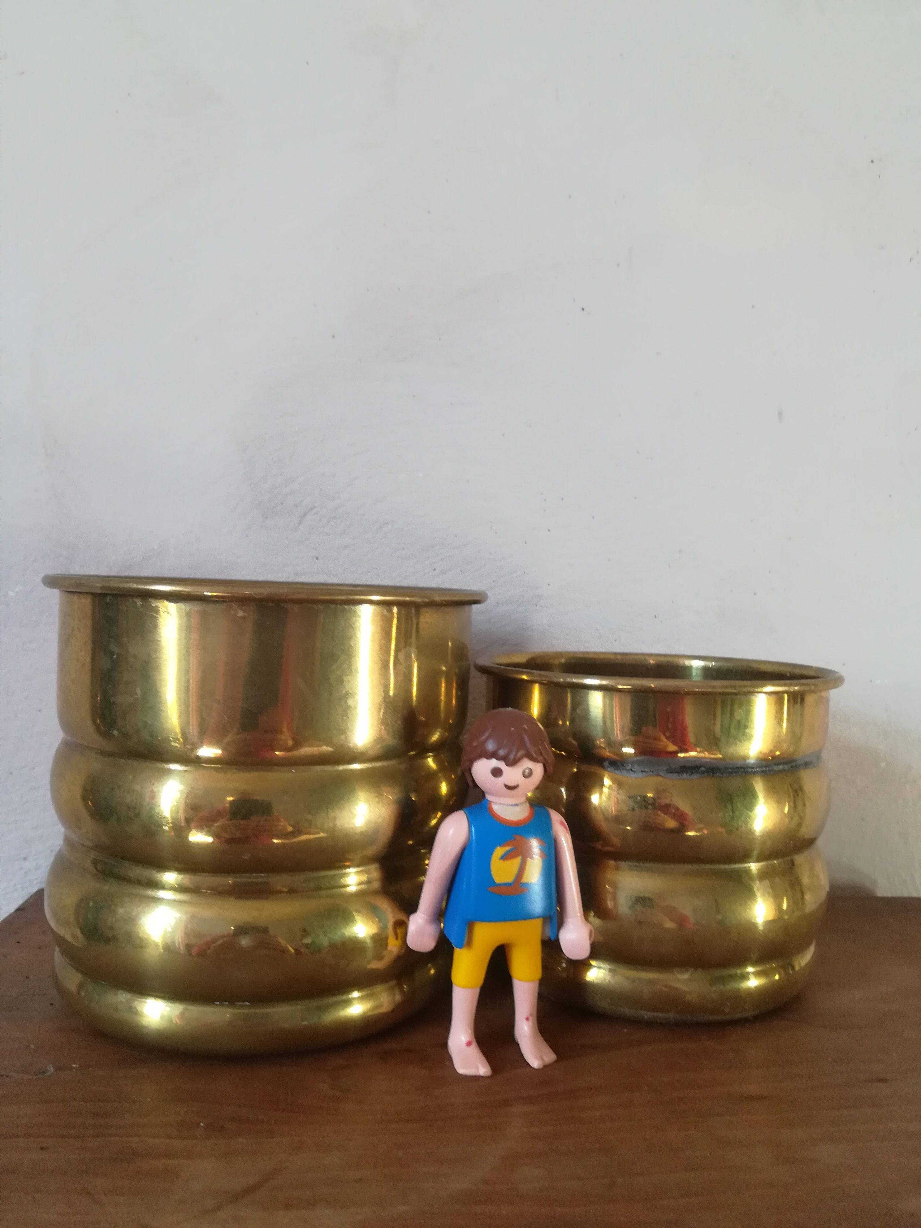 Duo of brass pot covers