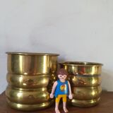 Duo of brass pot covers