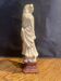 Soapstone sculpture on obsidian base of a Buddhist.