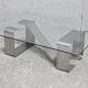 Coffee table with "kinetic" steel base and glass slab. Circa 1970.