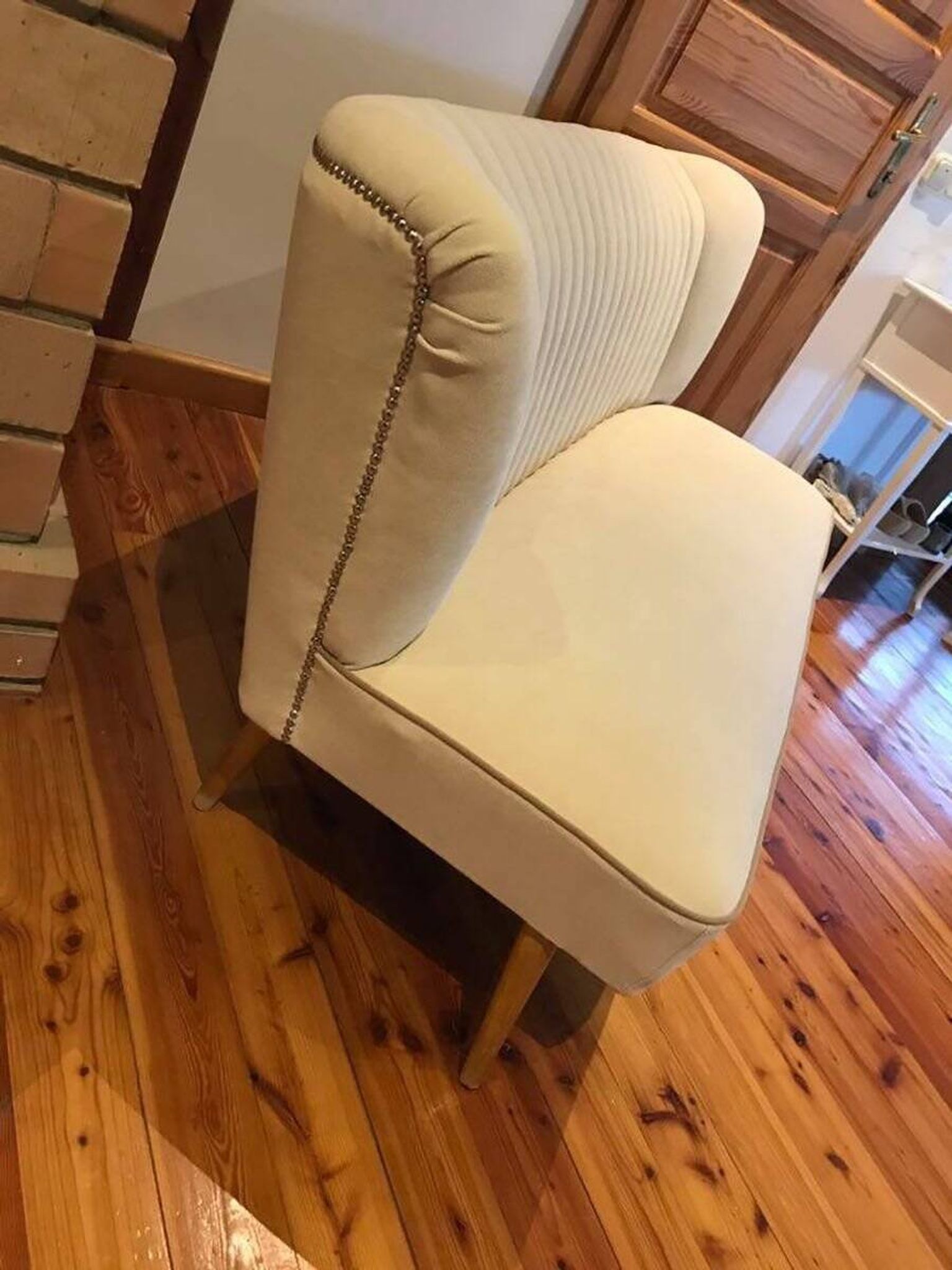 Mid-Century 1950s style two-seater canapé with cream fabric and solid beech.